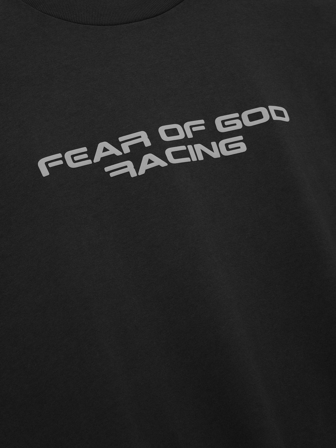 Fear of God Essentials Racing Panelled Modern Tee in black with a mock neck, oversized short sleeves, tiered hem and grey "Fear of God Racing" graphic on the chest - view 3