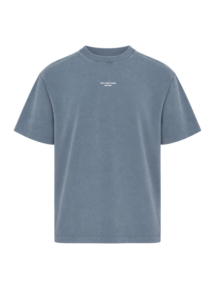 Drôle de Monsieur Classic Slogan Tee in washed slate blue with 'Not From Paris Madame' chest print, relaxed boxy fit, short sleeves, and ribbed crew neck