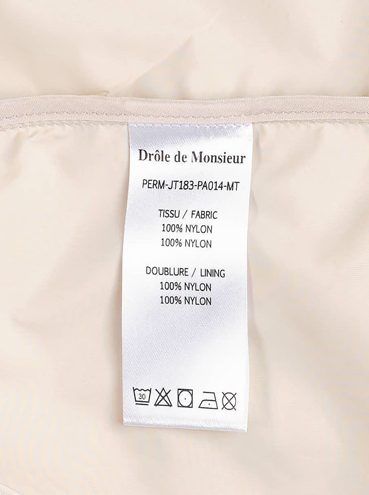Drôle de Monsieur Not From Paris Madame slogan coach jacket in ecru with snap-button closure, point collar, elasticated cuffs, and embroidered chest slogan - view 5