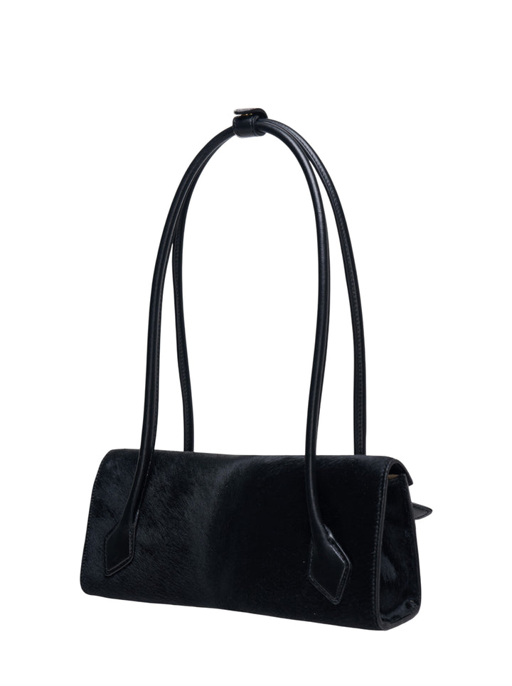Alaïa Teckel Flap Small bag in black haircalf with sculptural double-looped handle and envelope flap closure, front view - view 2