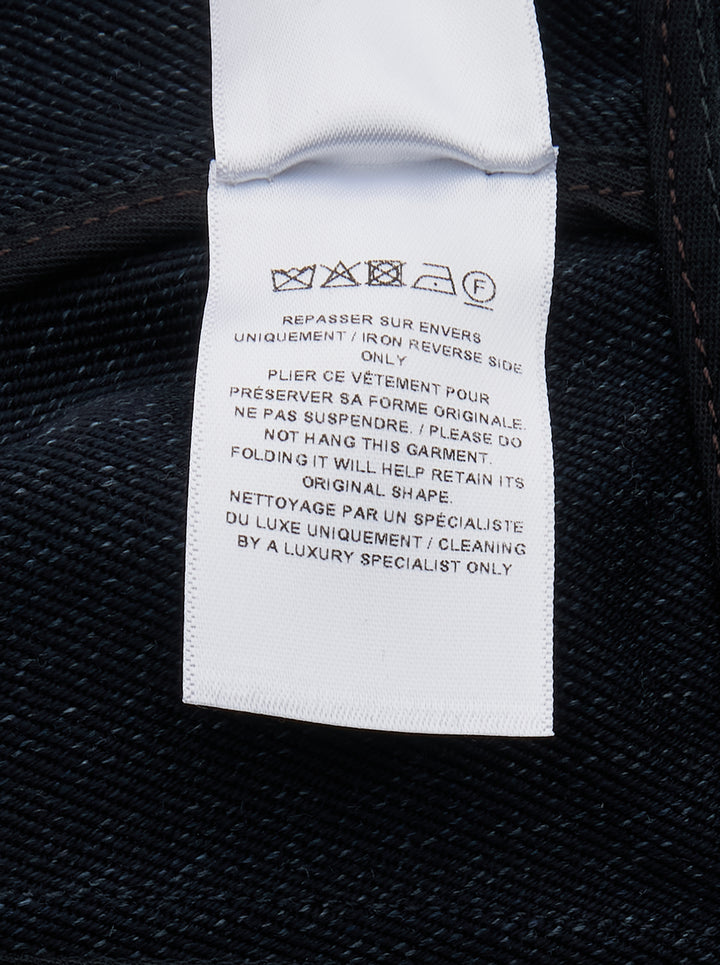 Alaïa Basque Shirt Wool Denim jacket in dark indigo, featuring a point collar, concealed button-front placket, structured basque waist seam, tonal contrast stitching, and a cropped curved hem — front view on white background - view 3