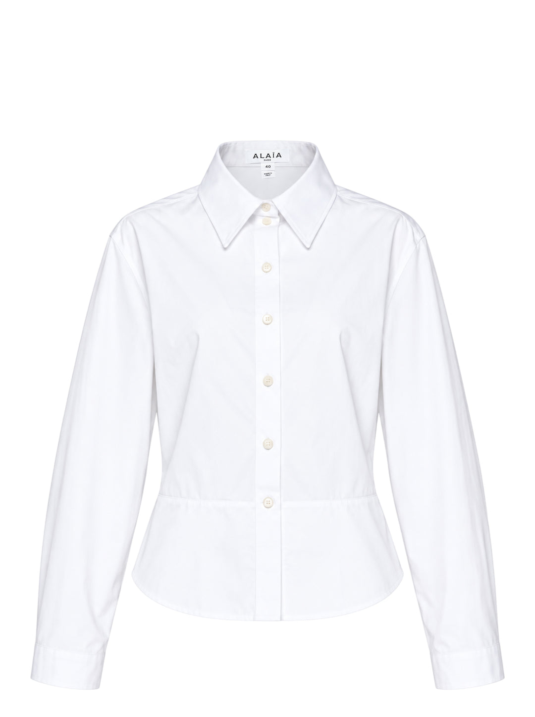 Alaïa Basque Cotton Poplin Shirt in white, featuring a sculpted waist seam, peplum hem, point collar, and mother-of-pearl button front fastening