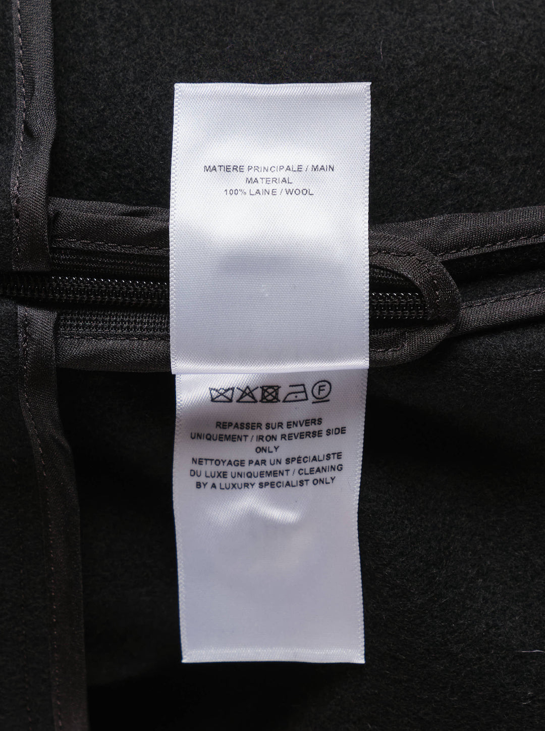 Alaïa light felted wool skater skirt in black, featuring a high wide waistband and full flared circle hem, displayed as a flat product shot on a white background - view 3
