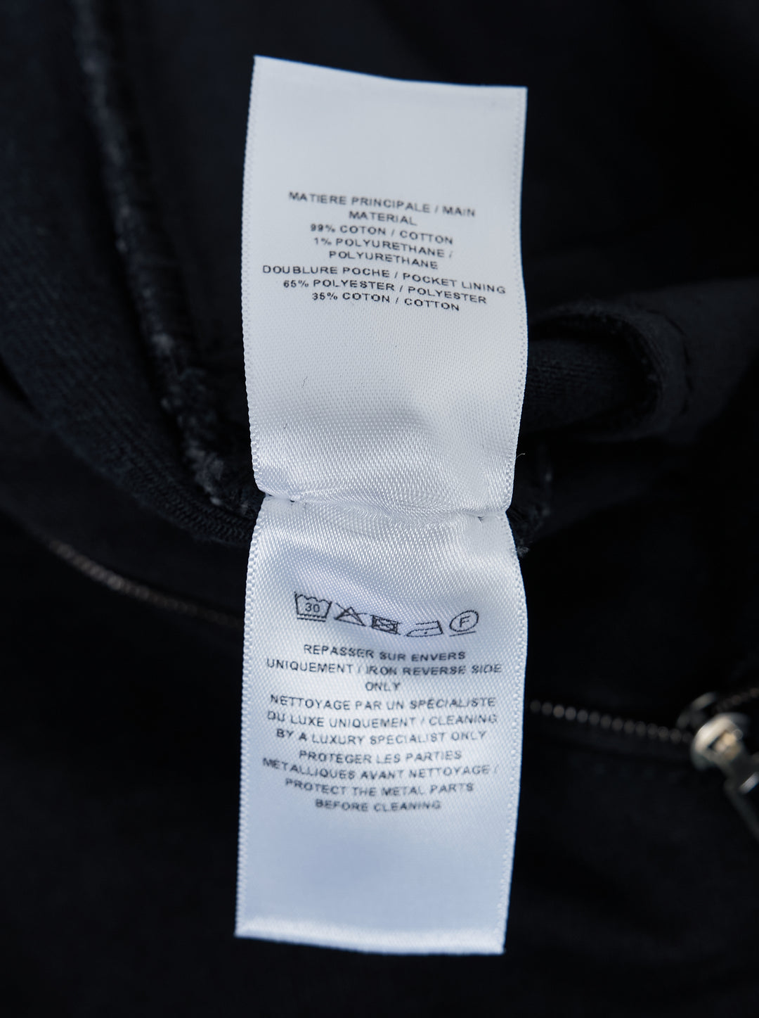 Alaïa black denim round pants with a high waist, five-pocket design and sculpted curved leg, shown from the front - view 3