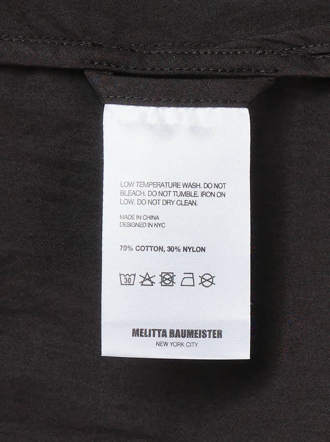 Melitta Baumeister Circle Shirt in black, featuring an asymmetric curved button placket, point collar, chest patch pocket, and structured long sleeves with wide cuffs - view 3