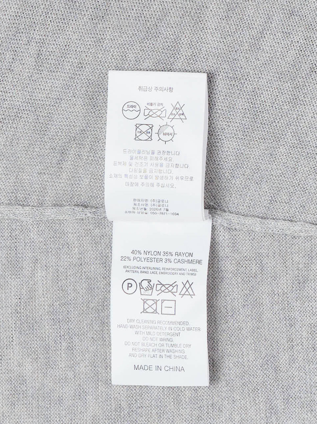 Glowny Nest Polo Mini Dress in grey marl knit with a ribbed polo collar, three-button placket, drawstring waist, and a navy pleated skirt panel with lace hem trim - view 3