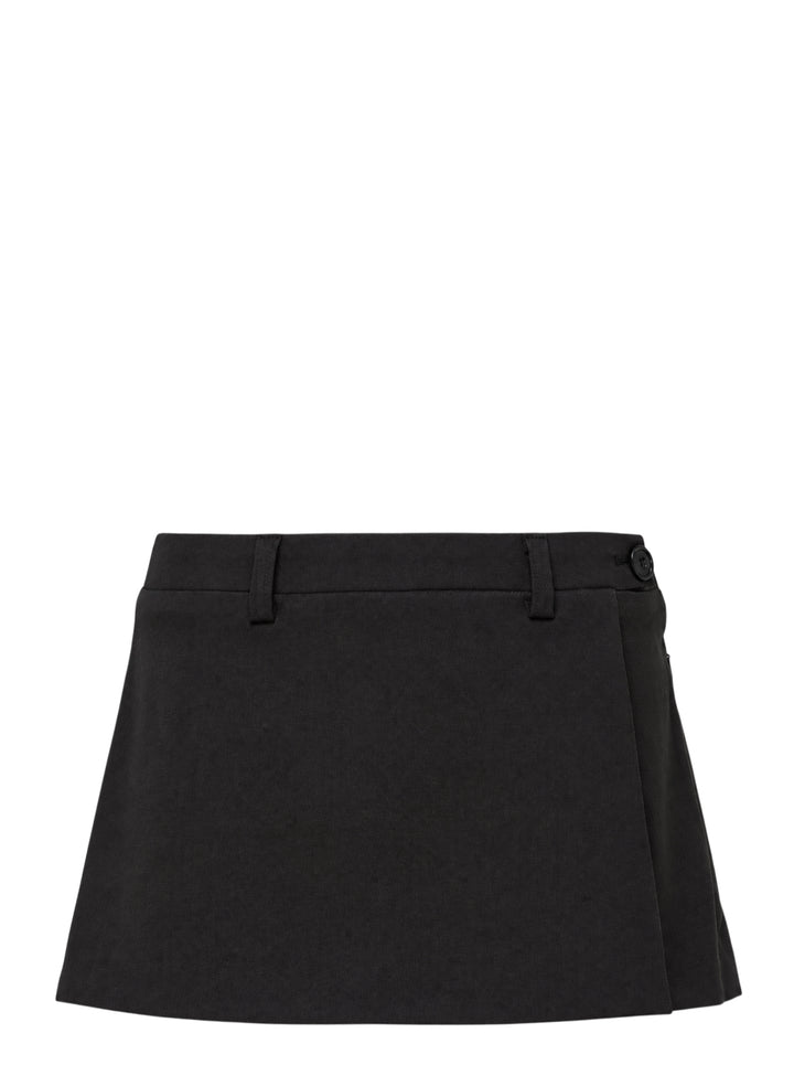 Glowny Polly Wrap Skorts in black, featuring a wrap-front A-line mini silhouette with structured waistband, belt loops, and button fastening