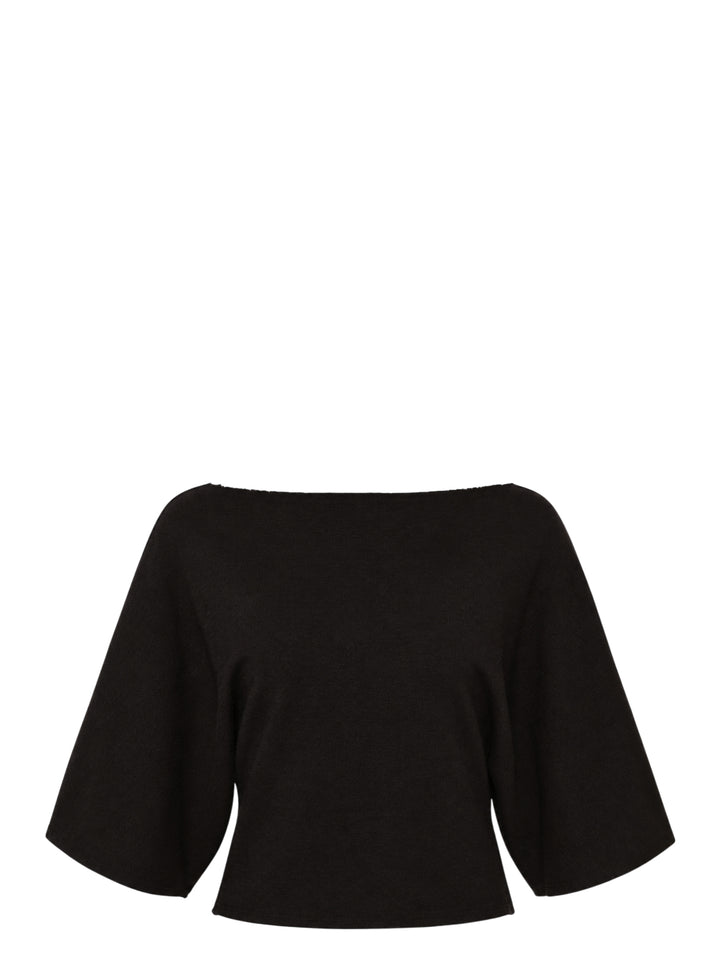 Glowny Melt Sleeve Blouse in black, featuring a wide bateau neckline and dramatic fluted three-quarter sleeves with a cropped silhouette