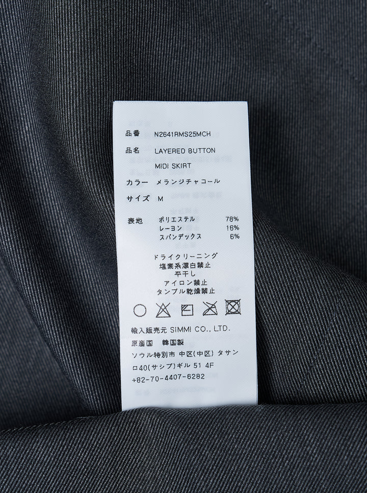 Nache charcoal grey A-line midi skirt with rows of dark buttons along both sides and buttoned waistband tabs - view 3