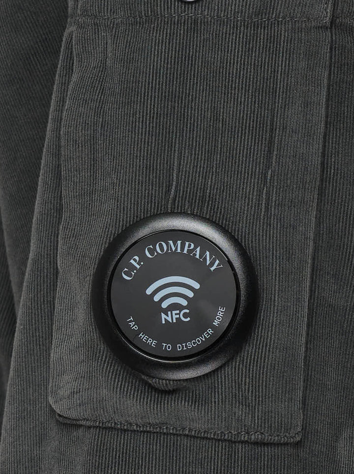 C.P. Company corduroy overshirt in washed charcoal with two large chest pockets and a Lens detail on the sleeve - view 4