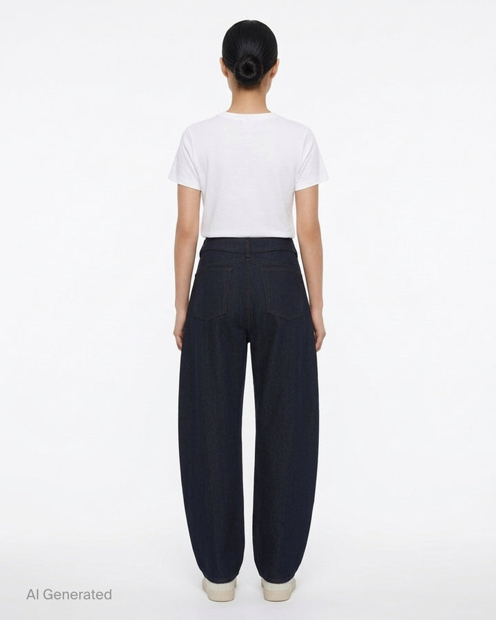 Alaïa round pants in dark navy wool denim with a high waist, curved barrel leg and contrast topstitching, shown from the front - back