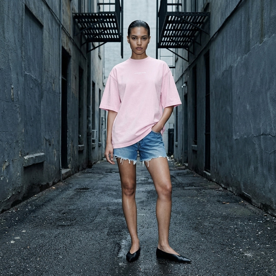 Alexander Wang oversized washed black short sleeve tee with centre chest logo print on white background - lifestyle