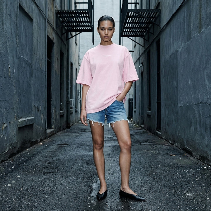 Alexander Wang oversized washed black short sleeve tee with centre chest logo print on white background - lifestyle