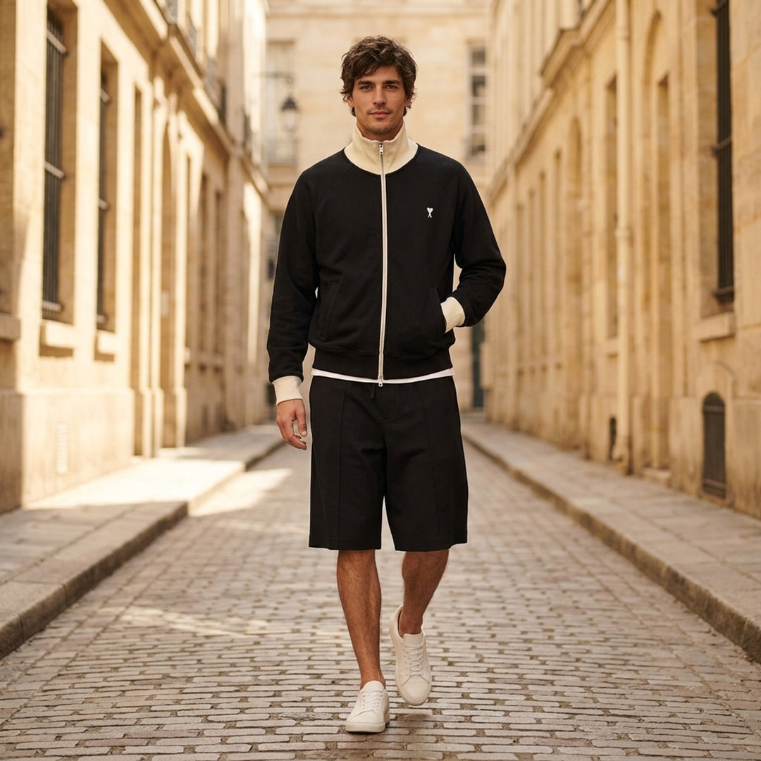 AMI black zip-up sweatshirt with cream funnel collar, ribbed cuffs and embroidered Ami de Coeur logo on the chest - lifestyle