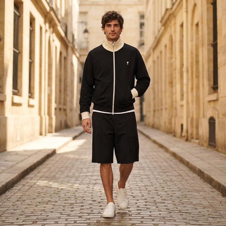 AMI black zip-up sweatshirt with cream funnel collar, ribbed cuffs and embroidered Ami de Coeur logo on the chest - lifestyle