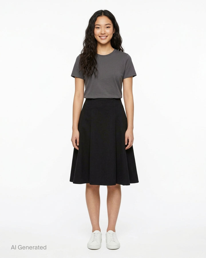 AMI black midi godet skirt with flared paneled silhouette and asymmetric hem, shown from the front - front