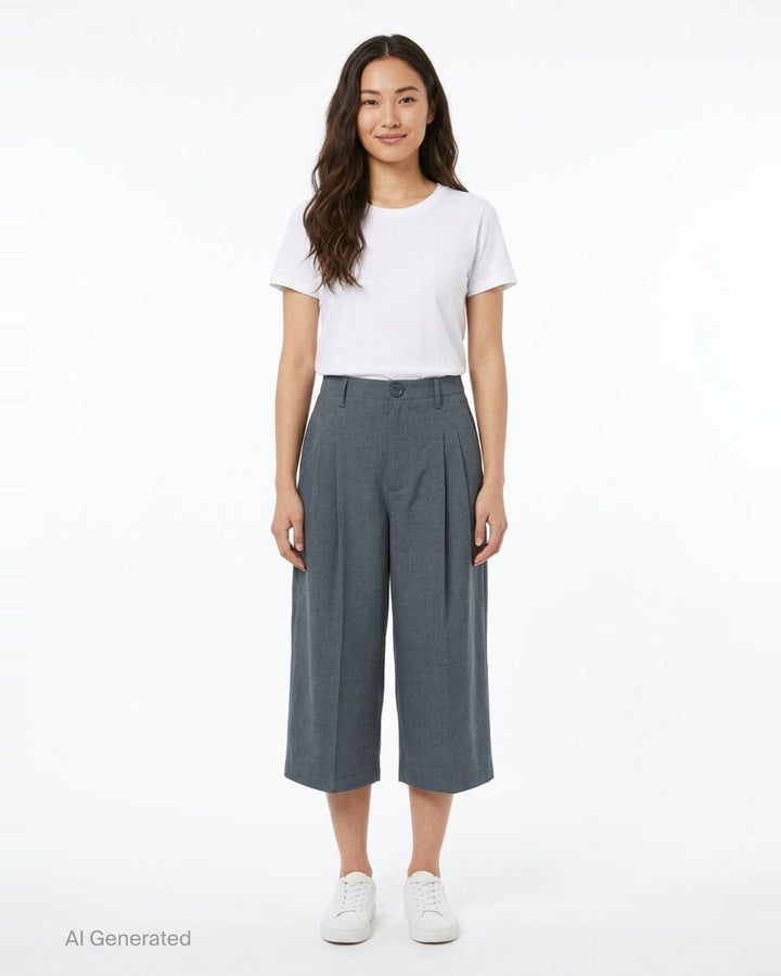 AMI Pleated Carrot Shorts in medium grey, featuring a high-rise waistband, double forward pleats, wide-leg carrot silhouette, and cuffed hem, displayed flat on a white background. - front