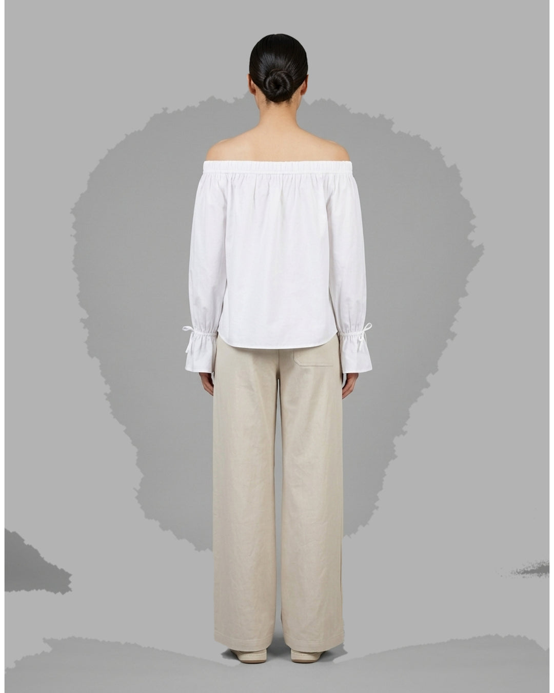 Club21 Collection Adele wide-leg pants in light neutral nylon cotton twill with patch pockets and double button waistband, front view - back