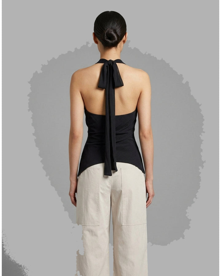 Black sleeveless halter top in crinkled silk-blend fabric with a scooped neckline and self-tie open back - back