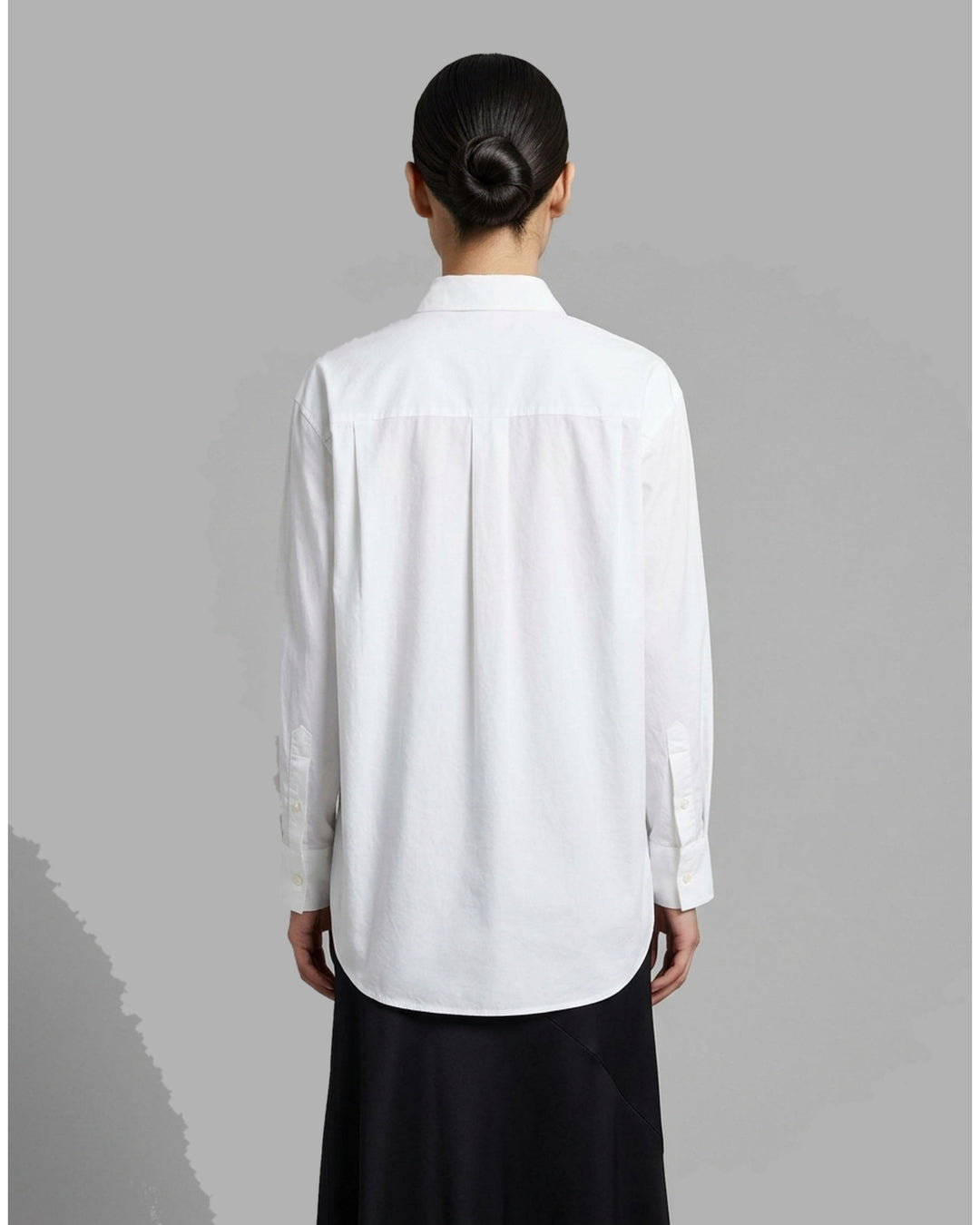 White structured cotton tuxedo shirt with pintucked bib front, pointed collar, concealed placket and long buttoned-cuff sleeves - back