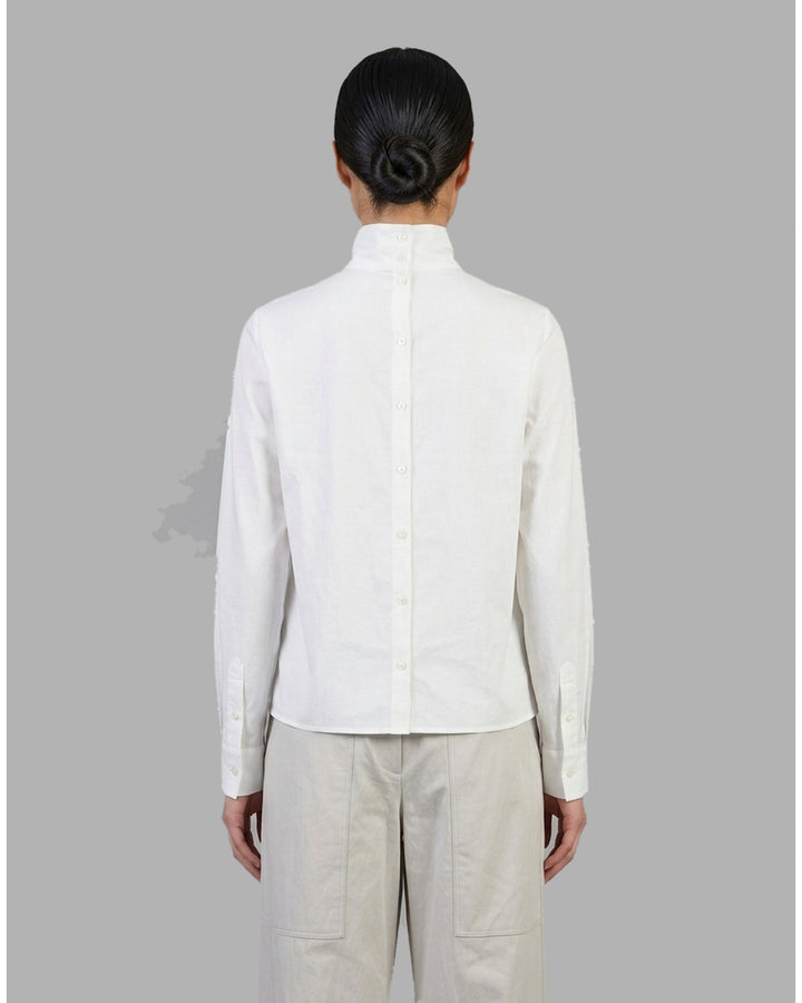 Black sheer silk cotton button-up shirt with stand collar and extended long sleeve cuffs, front view - back