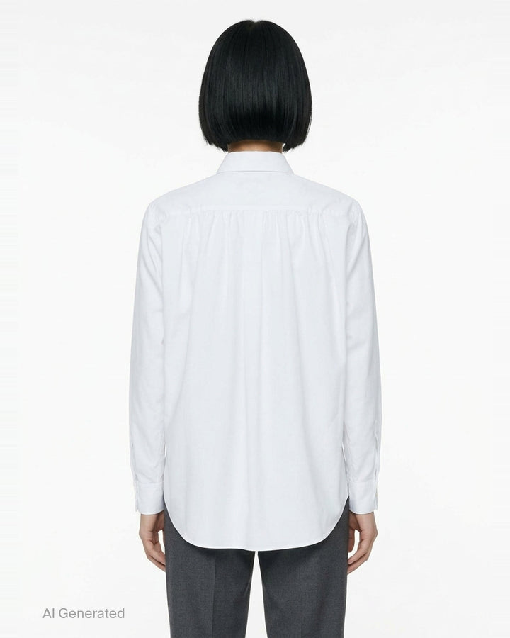 Comme des Garçons Black long sleeve polyester broad shirt in navy, featuring a point collar, tonal buttons, and a chest patch pocket - back