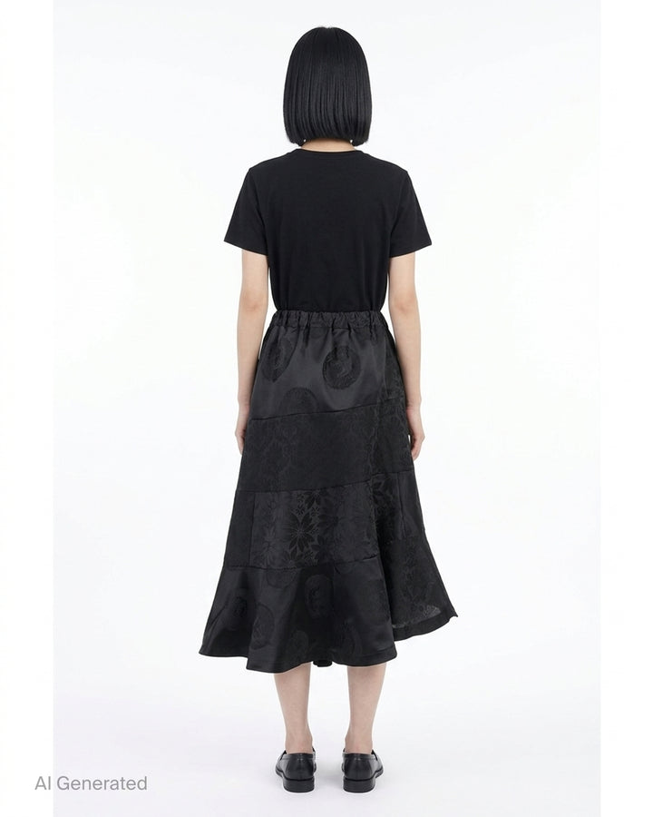 Black jacquard patchwork midi skirt with elasticated waist and asymmetric tiered flounce hem by Comme des Garçons Comme des Garçons - back