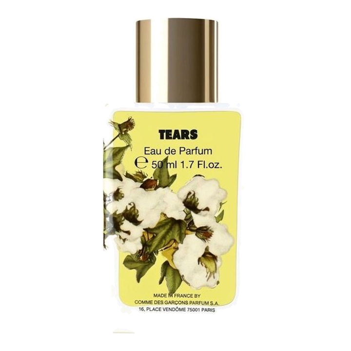 Tears Eau de Parfum 50ml by Comme des Garçons Parfums in a white glass bottle with a gold cap and yellow cotton blossom label - packshot