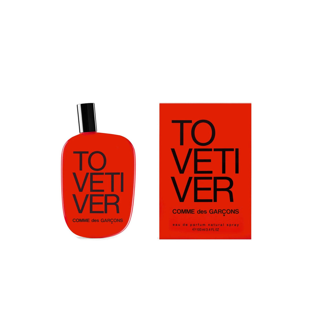 Comme des Garçons Tovetiver Eau de Parfum 100ml in a glossy red pebble-shaped bottle with black cap and bold black lettering - packshot