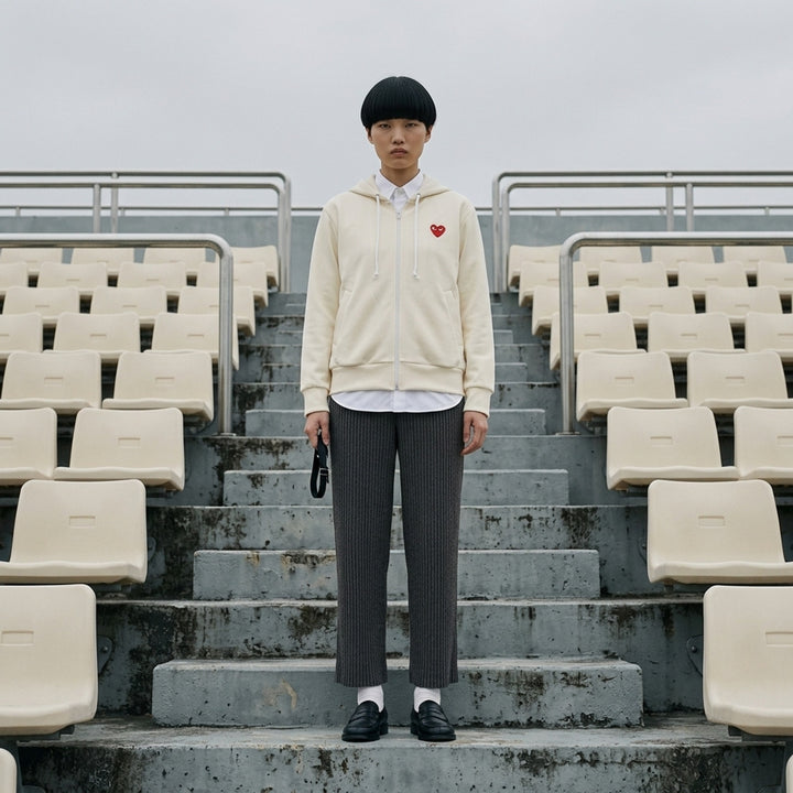 Comme des Garçons PLAY cream zip-up hoodie with drawstring hood and embroidered red heart logo on the chest - lifestyle
