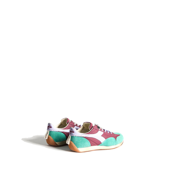 Diadora x JW Anderson retro nylon sneaker in blue with khaki suede overlays, coral laces, and a white Diadora logo stripe, set against a white background - packshot