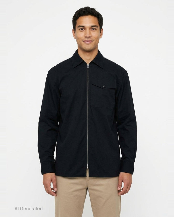 Dries Van Noten loose fit long sleeve zipped shirt in black with silver-tone centre-front zip, flap chest pocket with snap button, spread collar, and woven brand label at neckline - front