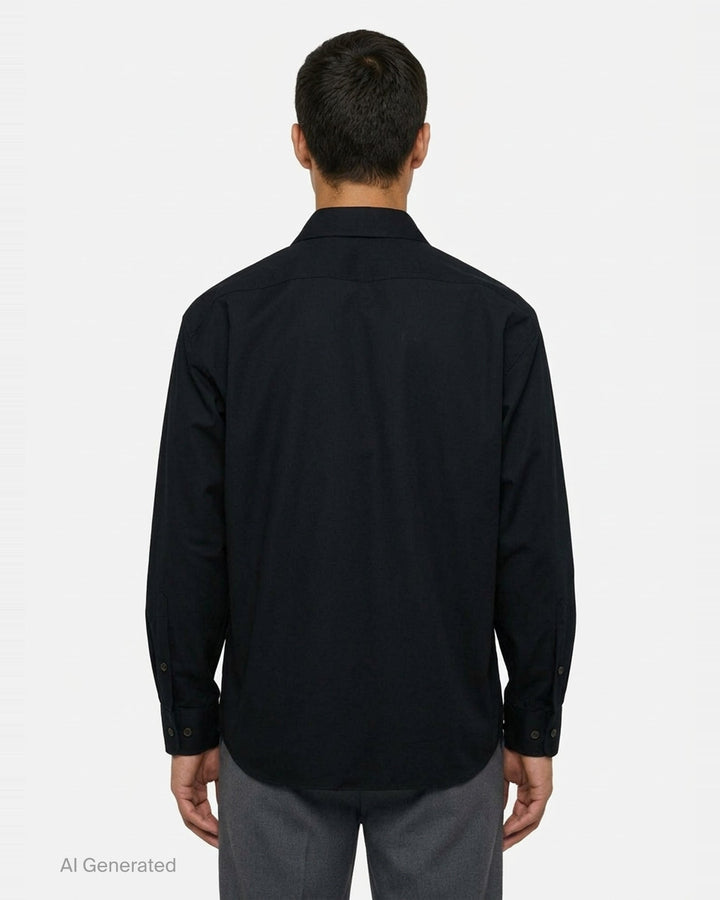 Dries Van Noten loose fit long sleeve zipped shirt in black with silver-tone centre-front zip, flap chest pocket with snap button, spread collar, and woven brand label at neckline - back