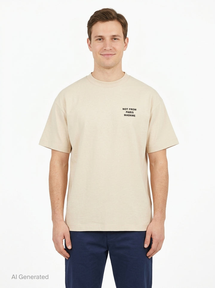 Drôle de Monsieur Not From Paris Madame slogan tee in cream with bold black chest text print, boxy fit, crew neck - front