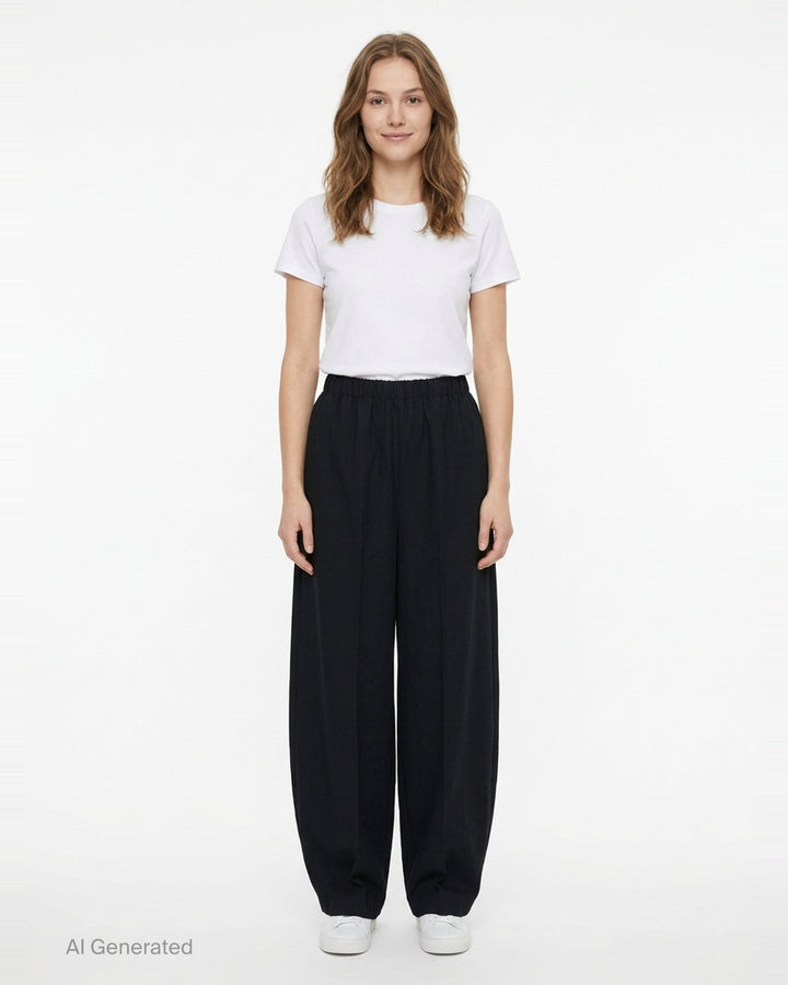 Enfold Straight Cocoon Pants in black — voluminous wide-leg silhouette with gathered elasticated waistband and tapered hem, front view on white background - front
