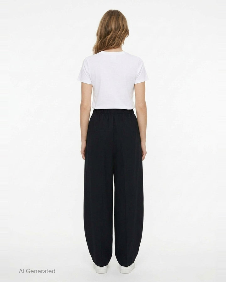 Enfold Straight Cocoon Pants in black — voluminous wide-leg silhouette with gathered elasticated waistband and tapered hem, front view on white background - back