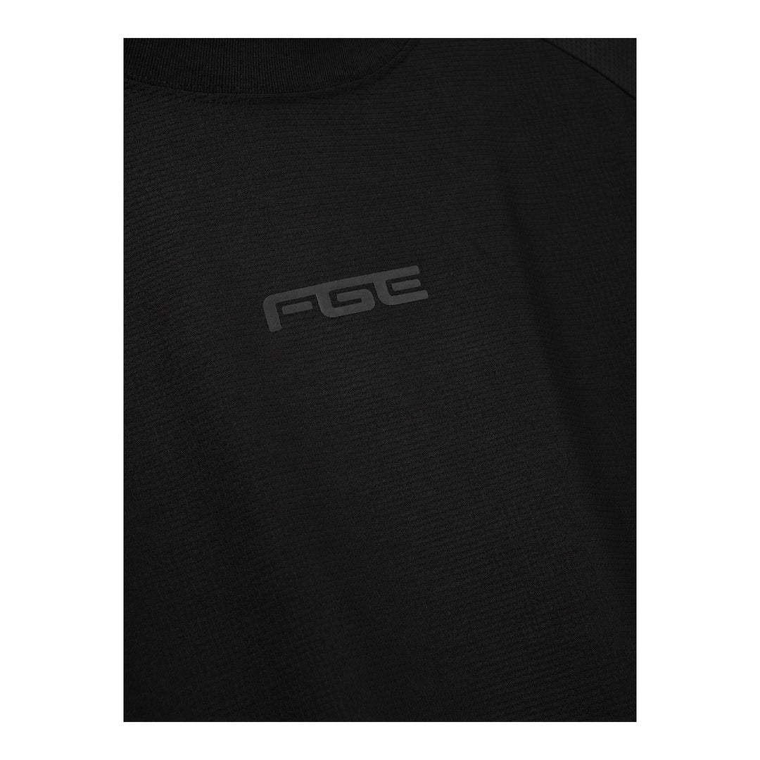 Fear of God Essentials Essential Raglan Tee in black with tonal FGE logo on the chest and ribbed crewneck, shown flat from the front - packshot