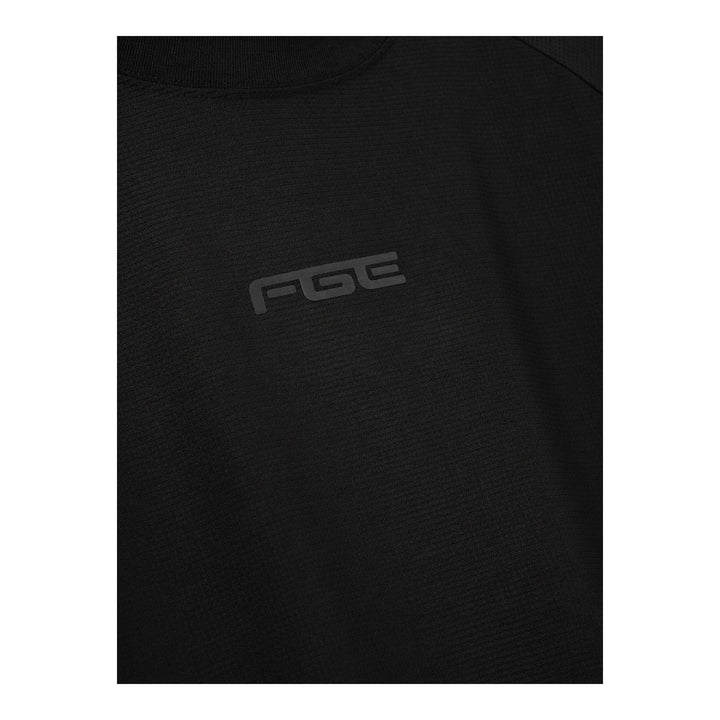 Fear of God Essentials Essential Raglan Tee in black with tonal FGE logo on the chest and ribbed crewneck, shown flat from the front - packshot