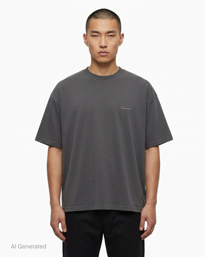 Fear of God Essentials Signature Short Sleeve Tee in washed grey, featuring an oversized boxy silhouette, ribbed crewneck, and tonal script logo at the chest - front
