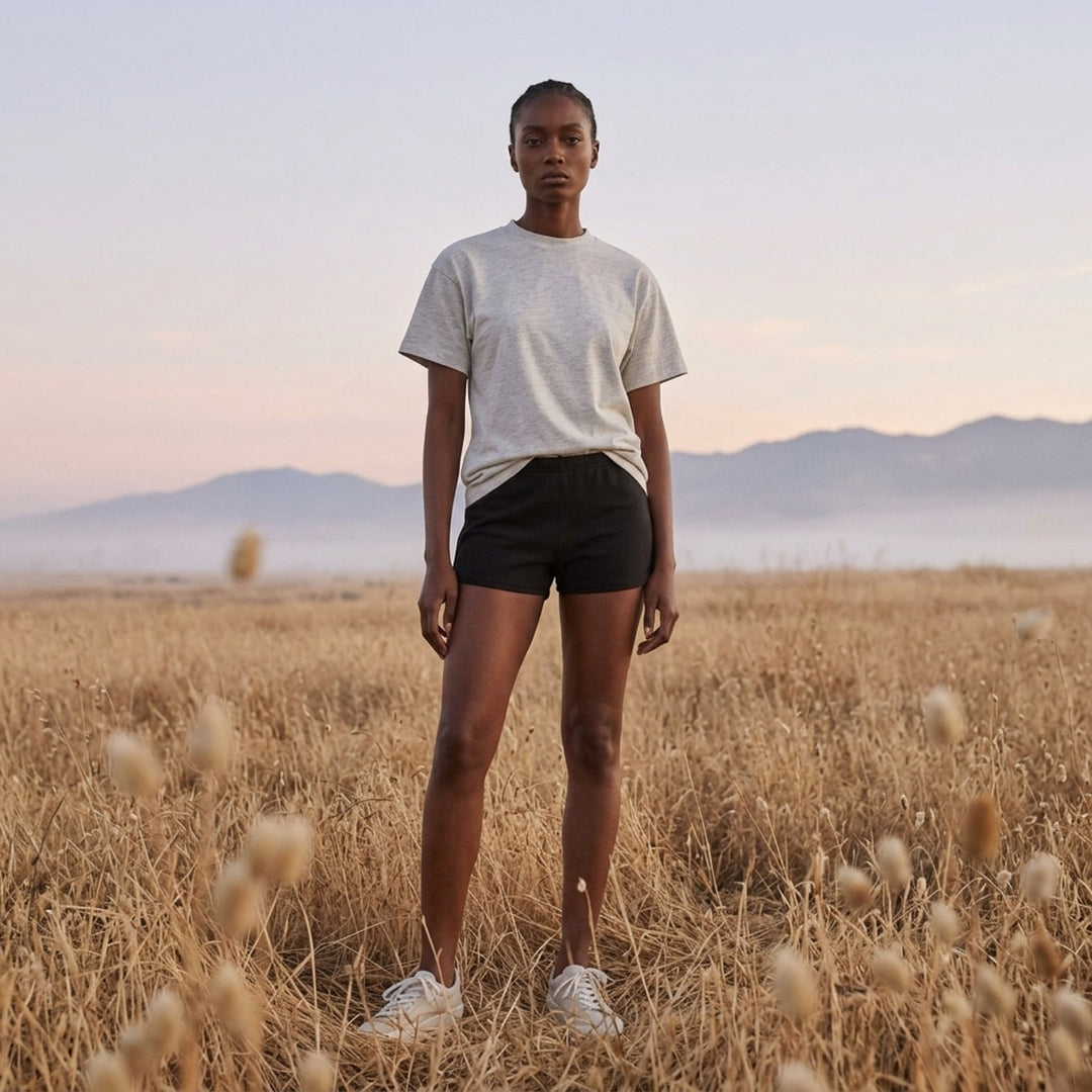 Fear of God ESSENTIALS women's black jersey shorts with elasticated waistband and tonal rubberised ESSENTIALS logo plaque - lifestyle