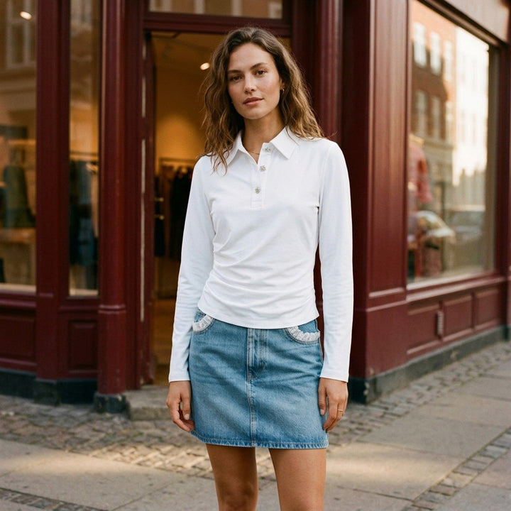 White long sleeve polo top with pointed collar, crystal buttons and ruched side draping - lifestyle