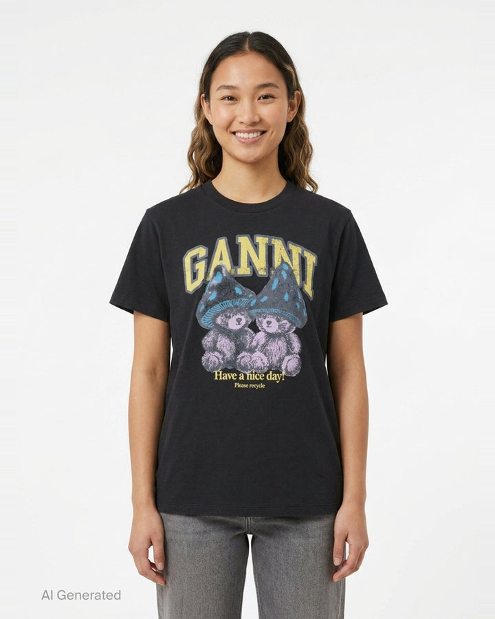 Ganni washed black relaxed cotton tee with distressed collegiate 'GANNI' lettering and a twin teddy bear mushroom graphic print reading 'Have a nice day! Please recycle' - front