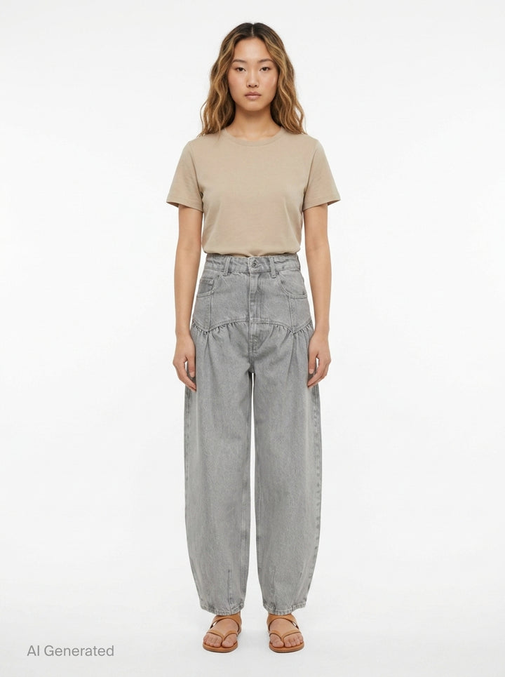 Ganni Rigid Denim Corset Jeans in light grey, featuring a high-rise waist, ruched corset seaming at the hip, and a wide balloon-leg silhouette tapering to small hem vents — front view on white background - front