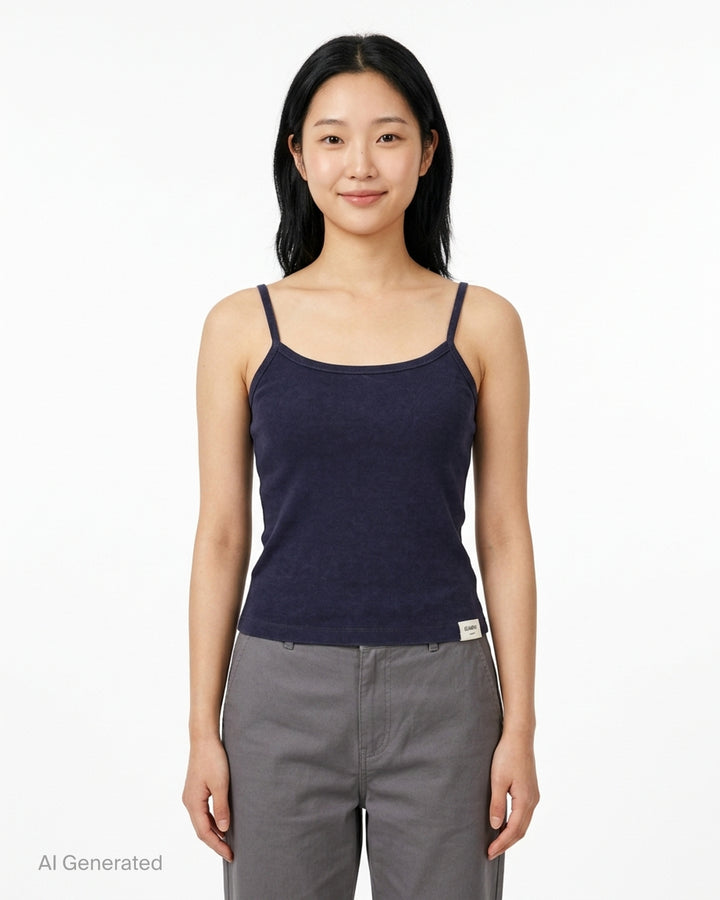 Glowny Classic Camisole in black — fine ribbed fabric, square neckline, thin straps, and woven brand label at the hem, shown on a flat lay against a white background - front