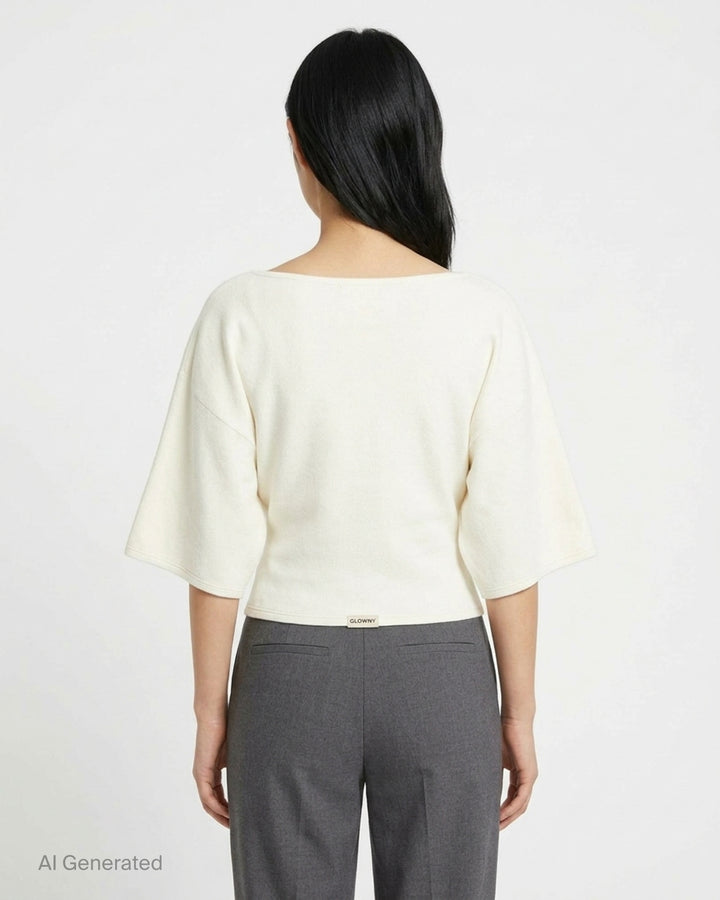 Glowny Melt Sleeve Blouse in black, featuring a wide bateau neckline and dramatic fluted three-quarter sleeves with a cropped silhouette - back