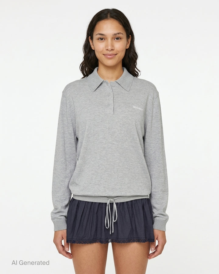 Glowny Nest Polo Mini Dress in grey marl knit with a ribbed polo collar, three-button placket, drawstring waist, and a navy pleated skirt panel with lace hem trim - front