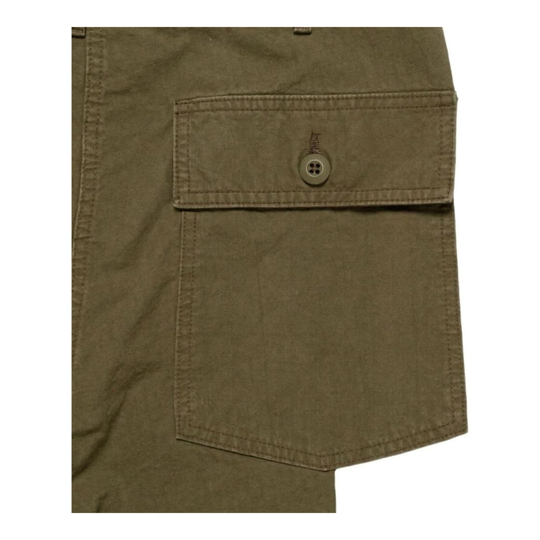 Human Made Baker Pants in washed olive green, shown flat with a relaxed wide-leg silhouette, contrast thigh patch, and front patch pockets - packshot