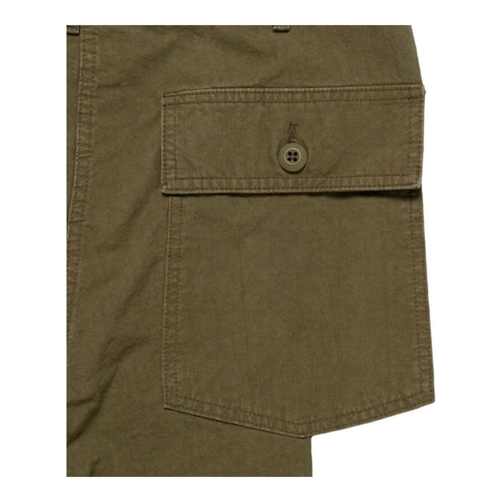 Human Made Baker Pants in washed olive green, shown flat with a relaxed wide-leg silhouette, contrast thigh patch, and front patch pockets - packshot