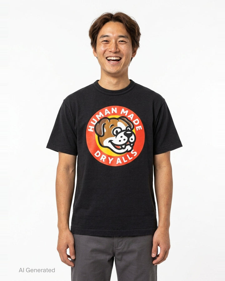 Human Made Dry Alls Graphic Tee in black, featuring a large circular bulldog mascot badge print at the chest with red, yellow, and white detailing - front