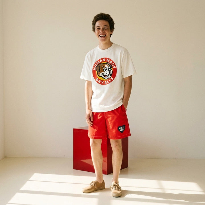 Human Made Dry Alls Graphic Tee in black, featuring a large circular bulldog mascot badge print at the chest with red, yellow, and white detailing - lifestyle